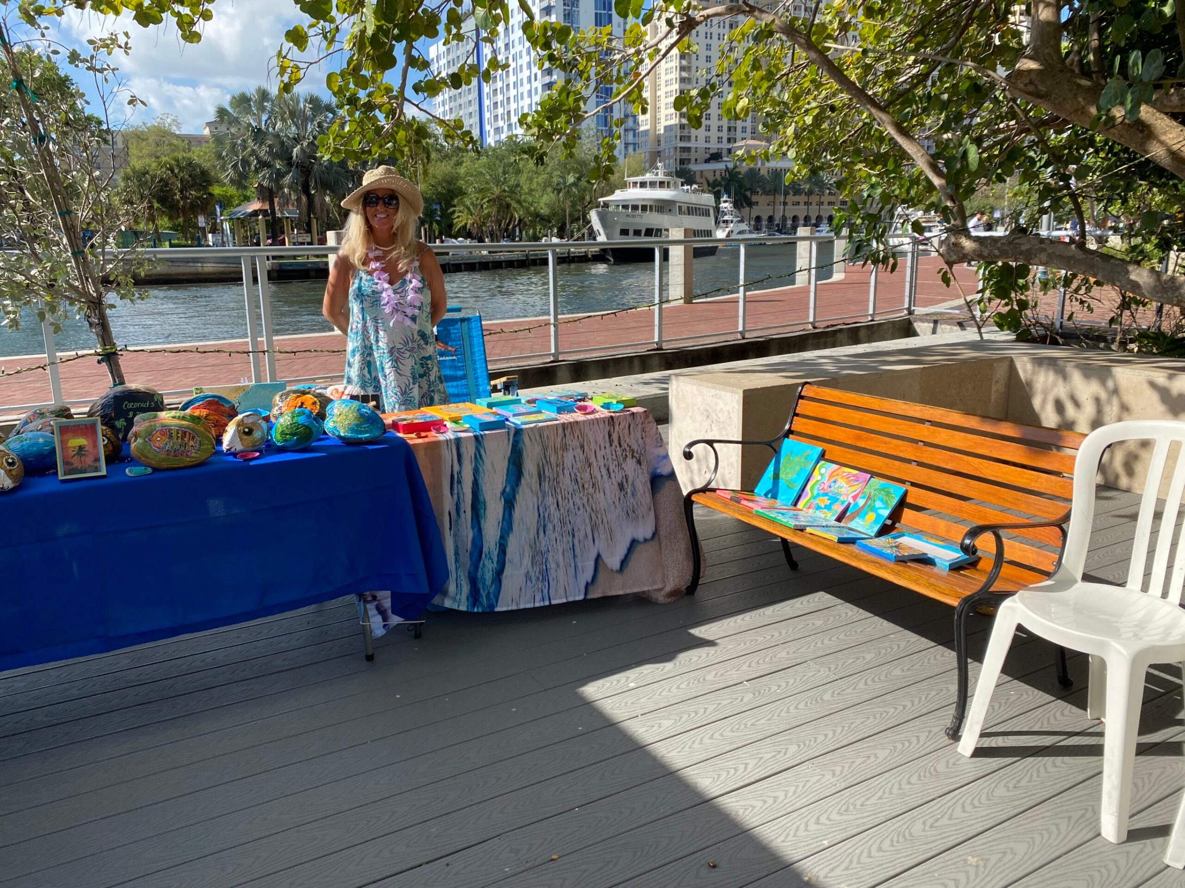 a person sitting on a bench in a park