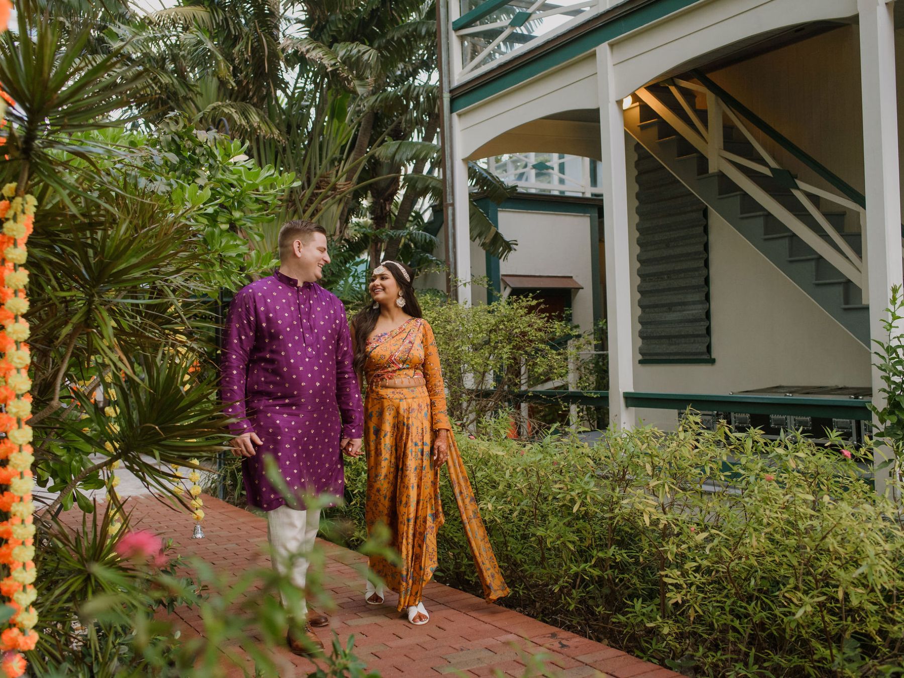a person standing in front of a christmas tree