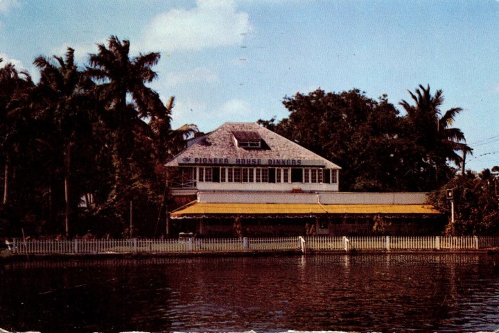 a house next to a body of water