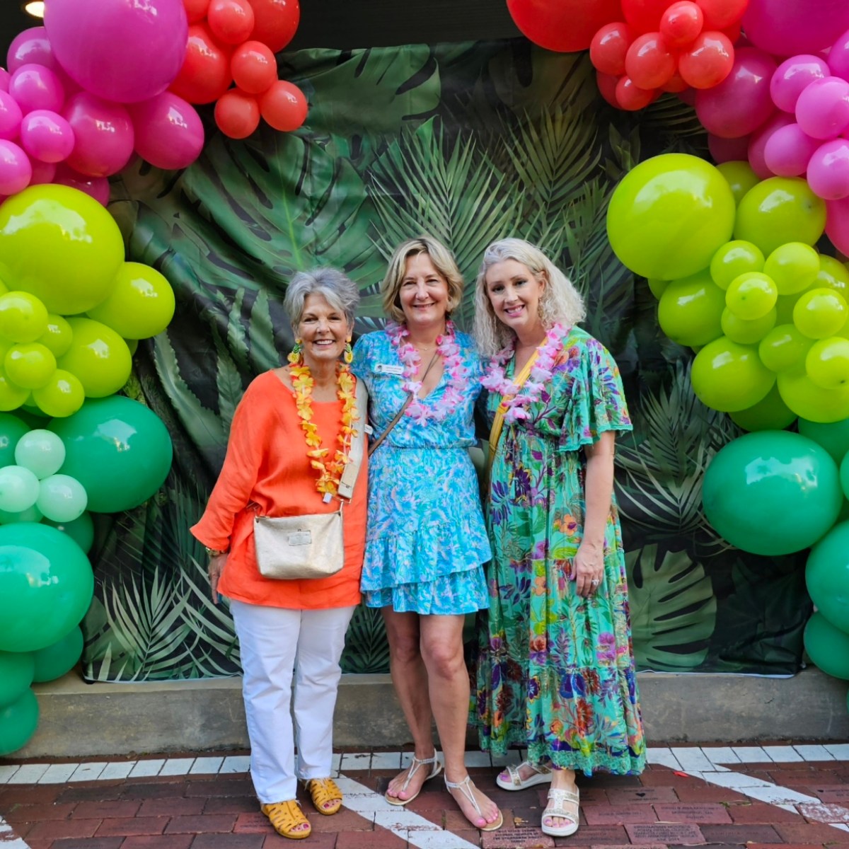 a group of people standing in front of a fruit stand