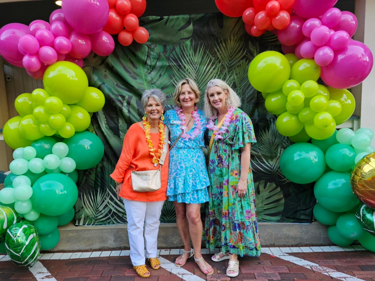 a group of people standing in front of a fruit stand