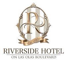 Riverside Hotel logo with a decorative 'R' and 'Est. 1936' banner.