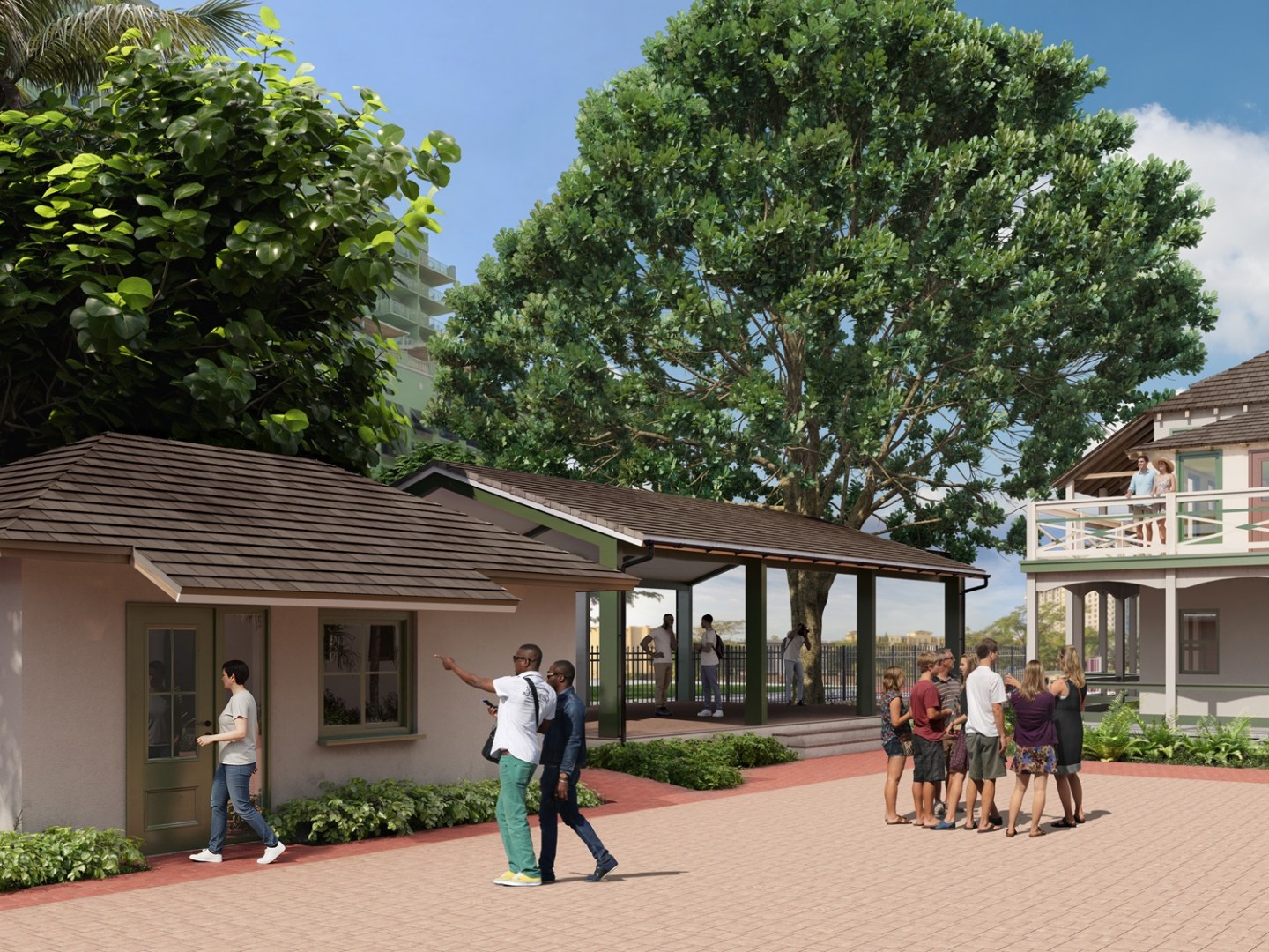 People walking in a courtyard with buildings and large trees.